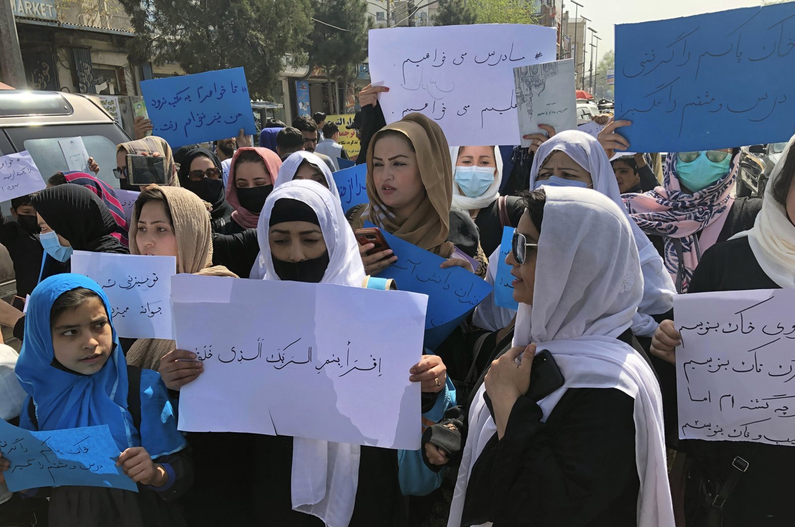 Afghan women chant and hold signs of protest during a demonstration in Kabul, Afghanistan, March 26, 2022. (AP Photo)