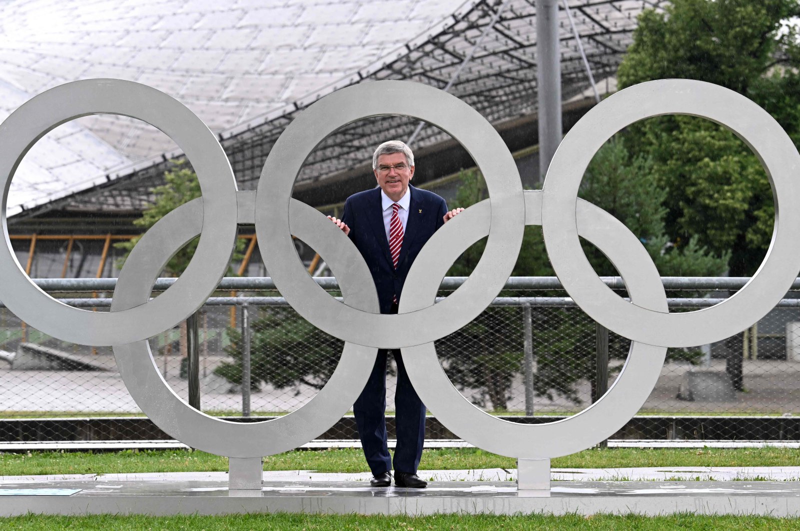 International Olympic Committee President (IOC) Thomas Bach poses behind the Olympic Rings, Munich, Germany, July 1, 2022. (AFP Photo)