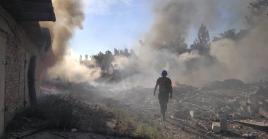 A rescuer walks among debris at a site of a residential area destroyed by a Russian military strike, in the town of Toretsk, Donetsk region, Ukraine, July 27, 2022. (State Emergency Service of Ukraine via Reuters)