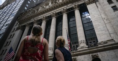 Pedestrians pass the New York Stock Exchange (NYSE) in New York, U.S., July 14, 2022. (AP Photo)