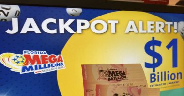 In this July 27, 2022, file photo, Mega Millions lottery tickets are shown at a lottery retailer in Surfside, Florida. A giant Mega Millions lottery jackpot ballooned to over $1 billion after no one matched all six numbers and won the top prize. (AP File Photo)