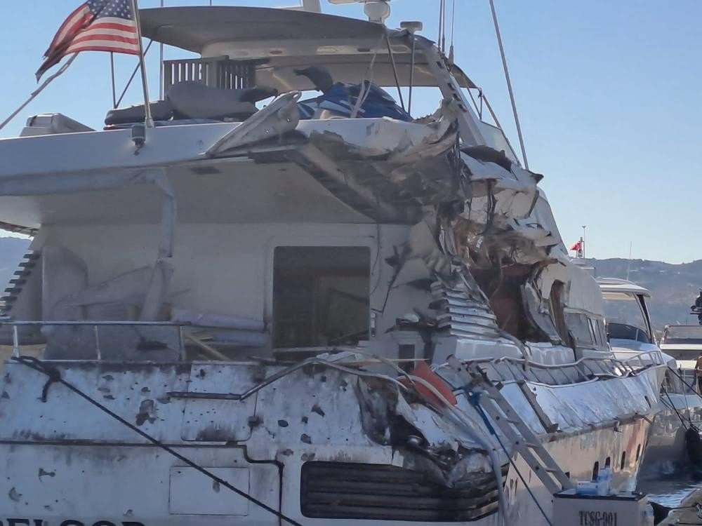 The damaged luxury yacht caught after a chase by a coast guard boat after a tipoff that it was trafficking drugs, Bodrum, Muğla, Turkey, July 29, 2022. (IHA Photo)