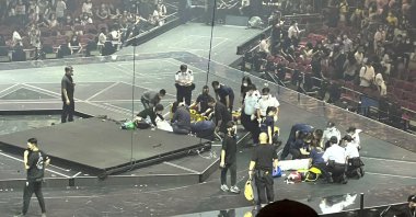 Two dancers receive medical treatment at a concert of Cantopop boy band Mirror, in Hong Kong, July 28, 2022. (AP Photo)