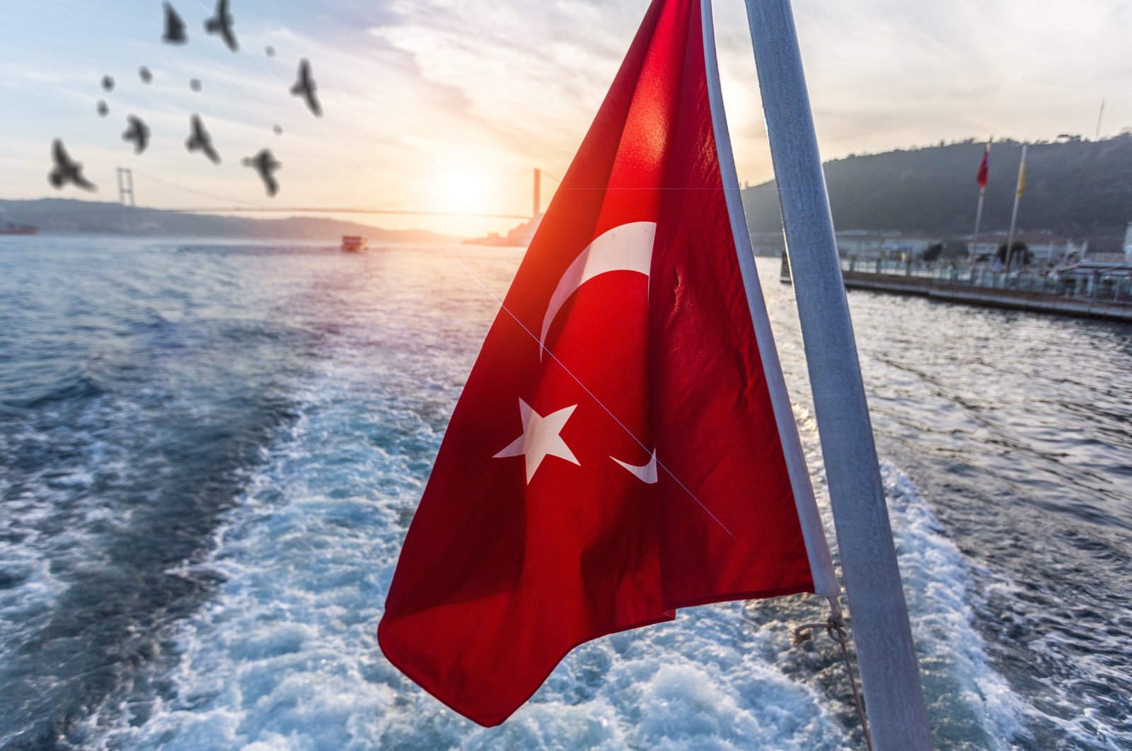 The Turkish flag waves from a ferry on the Bosporus in Istanbul, Turkey, July 15, 2022 (Shutterstock Photo)
