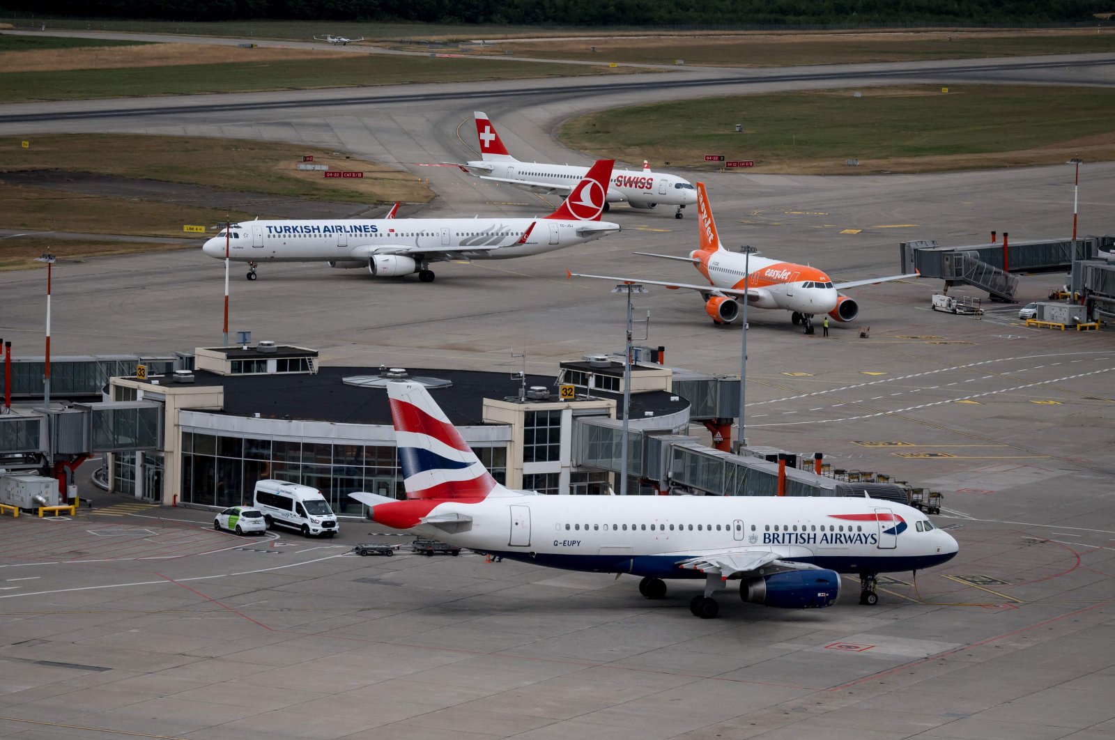 British Airways, Swiss International Air Lines, EasyJet and Turkish Airlines planes are seen from the Geneva Airport air traffic control, Switzerland, July 28, 2022. (AFP Photo)