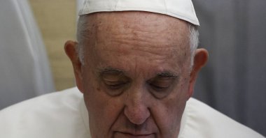 Pope Francis holds a news conference aboard the papal plane on his flight back after visiting Canada, July 30, 2022. (EPA Photo)