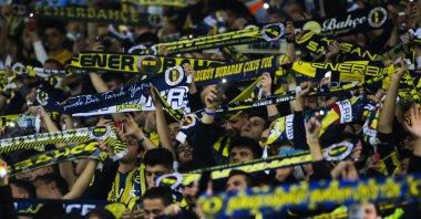 Fenerbahçe fans cheer prior to the Europa League group D soccer match between Fenerbahçe and Antwerp at the Sukru Saracoglu stadium in Istanbul, Turkey, Oct. 21, 2021. (AP File Photo)