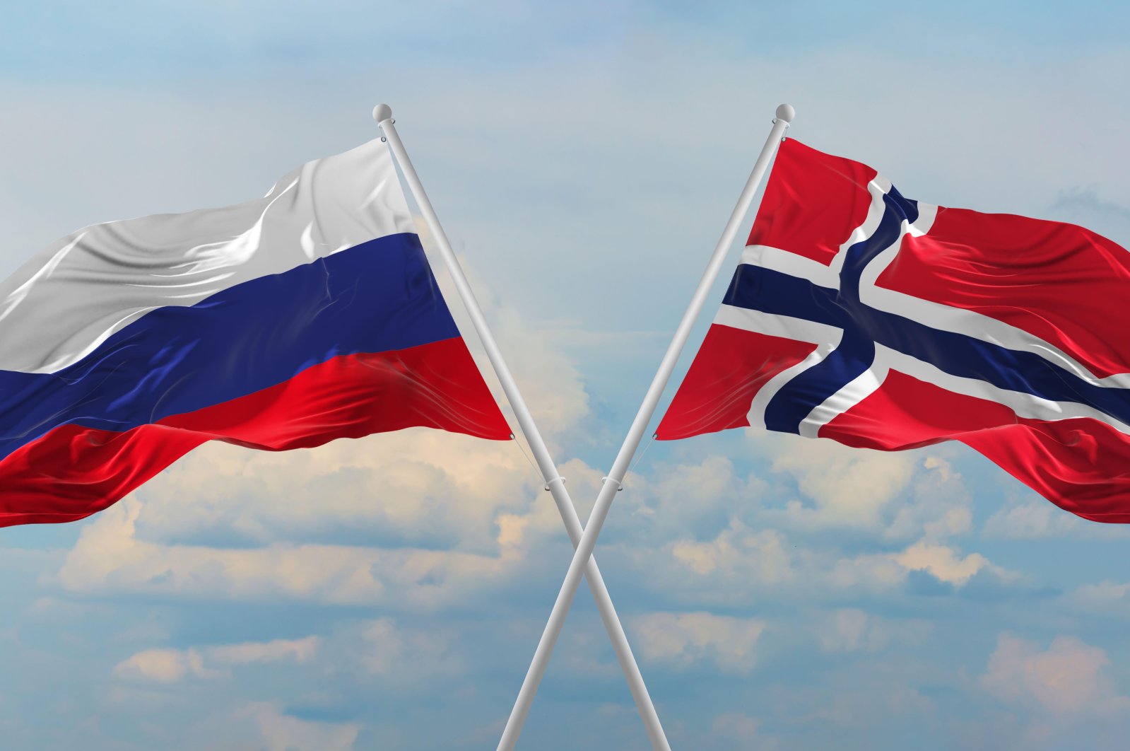 The flags of Russia (L) and Norway wave in opposite directions in this undated file photo. (Alamy Photo via Reuters)