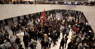 Supporters of Iraqi cleric Muqtada al-Sadr, protesting against a rival bloc&#039;s nomination for prime minister, gather inside the parliament in the high-security Green Zone in the capital Baghdad, Iraq, July 31, 2022. (AFP Photo)