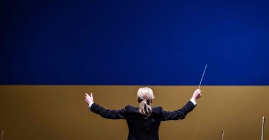 Conductor Kerii-Lynn Wilson leads musicians from the Ukrainian Freedom Orchestra during a rehearsal in the Warsaw Opera before their international tour, in Warsaw, Poland, July 28, 2022. (AFP Photo)