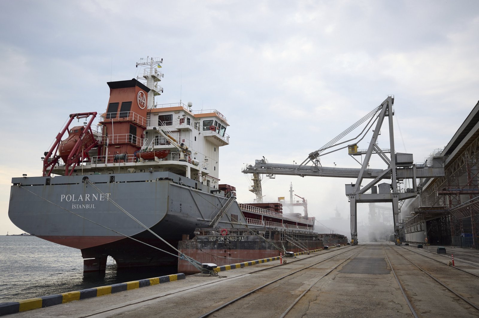 A Turkish Polarnet cargo ship is loaded with Ukrainian grain in a port in the Odessa region, Ukraine, July 29, 2022. (Ukrainian Presidential Press Office via AP)
