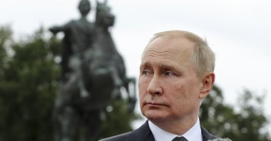 Russian President Vladimir Putin delivers a speech in front of the equestrian statue of Peter the Great, on the Neva River, in St. Petersburg, Russia, July 31, 2022. (AP Photo)