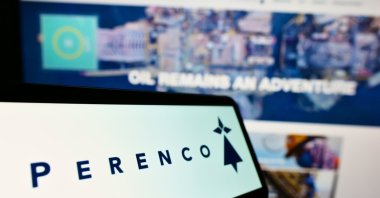 The logo of Anglo-French oil and gas company Perenco S.A. on a screen in front of business website, Stuttgart, Germany, June 19, 2021. (Shutterstock Photo)