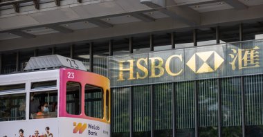 A tram transits in front of the Hongkong and Shanghai Banking Corporation Limited (HSBC) headquarters in Hong Kong, China, Aug.1, 2022. (EPA Photo)