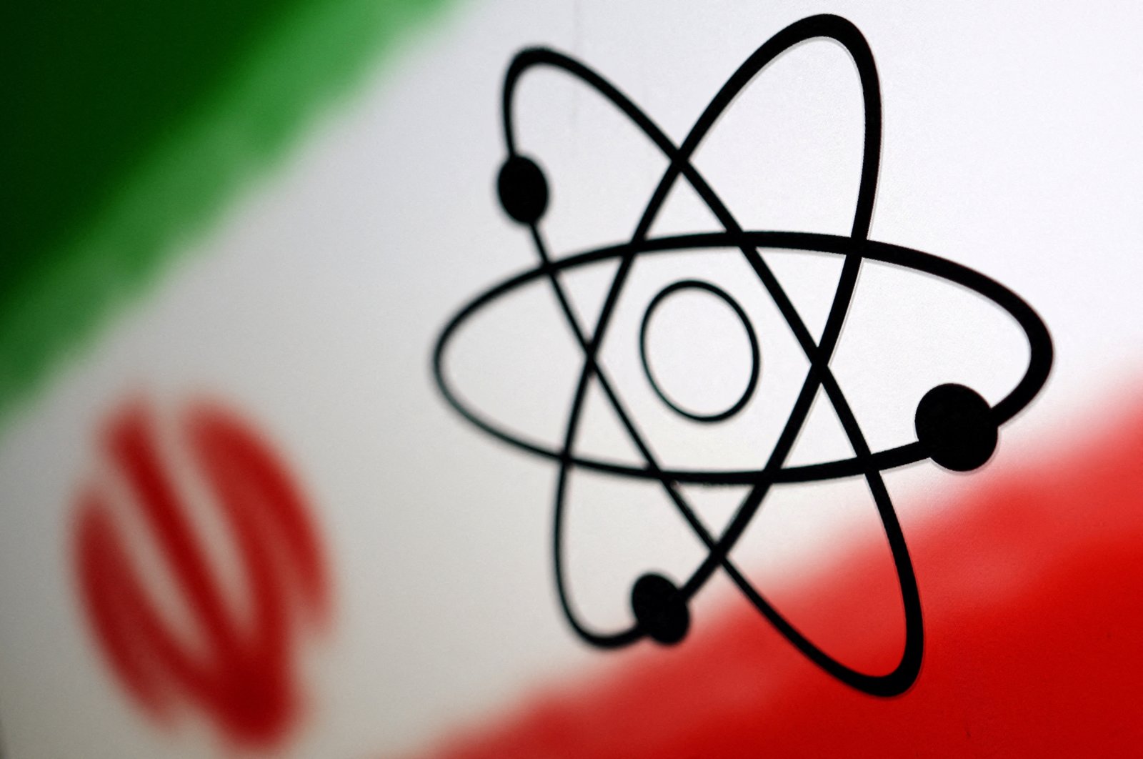 Atom symbol and Iran flag are seen in this illustration, July 21, 2022. (Reuters Photo)