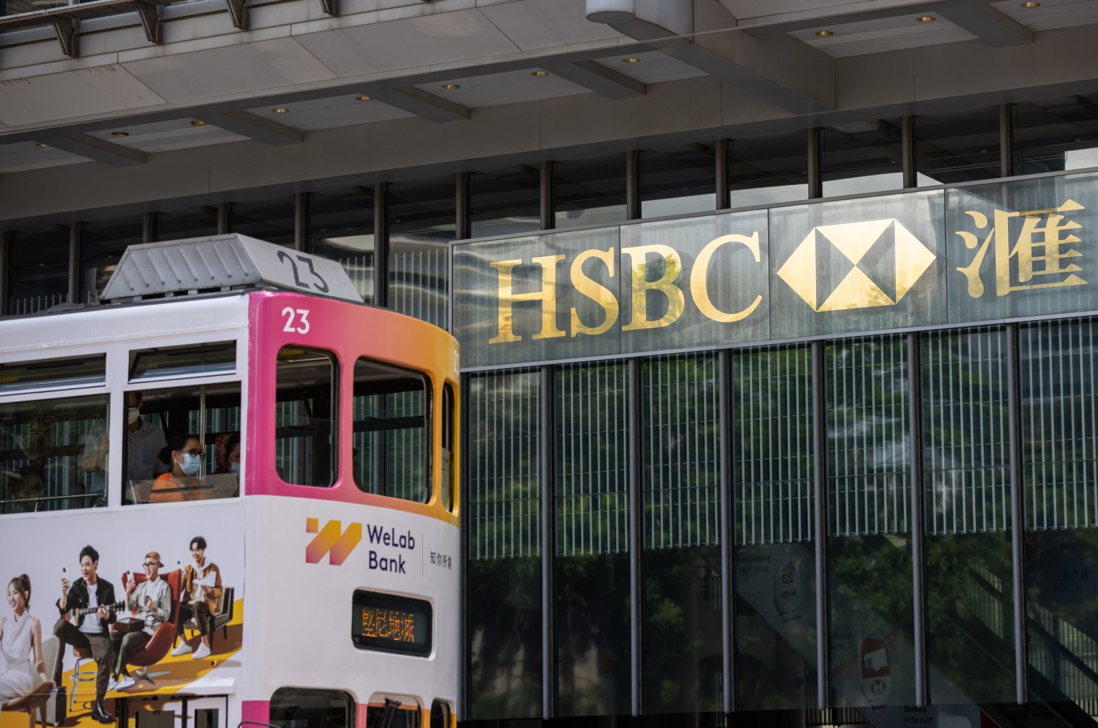 A tram transits in front of the Hongkong and Shanghai Banking Corporation Limited (HSBC) headquarters in Hong Kong, China, Aug.1, 2022. (EPA Photo)