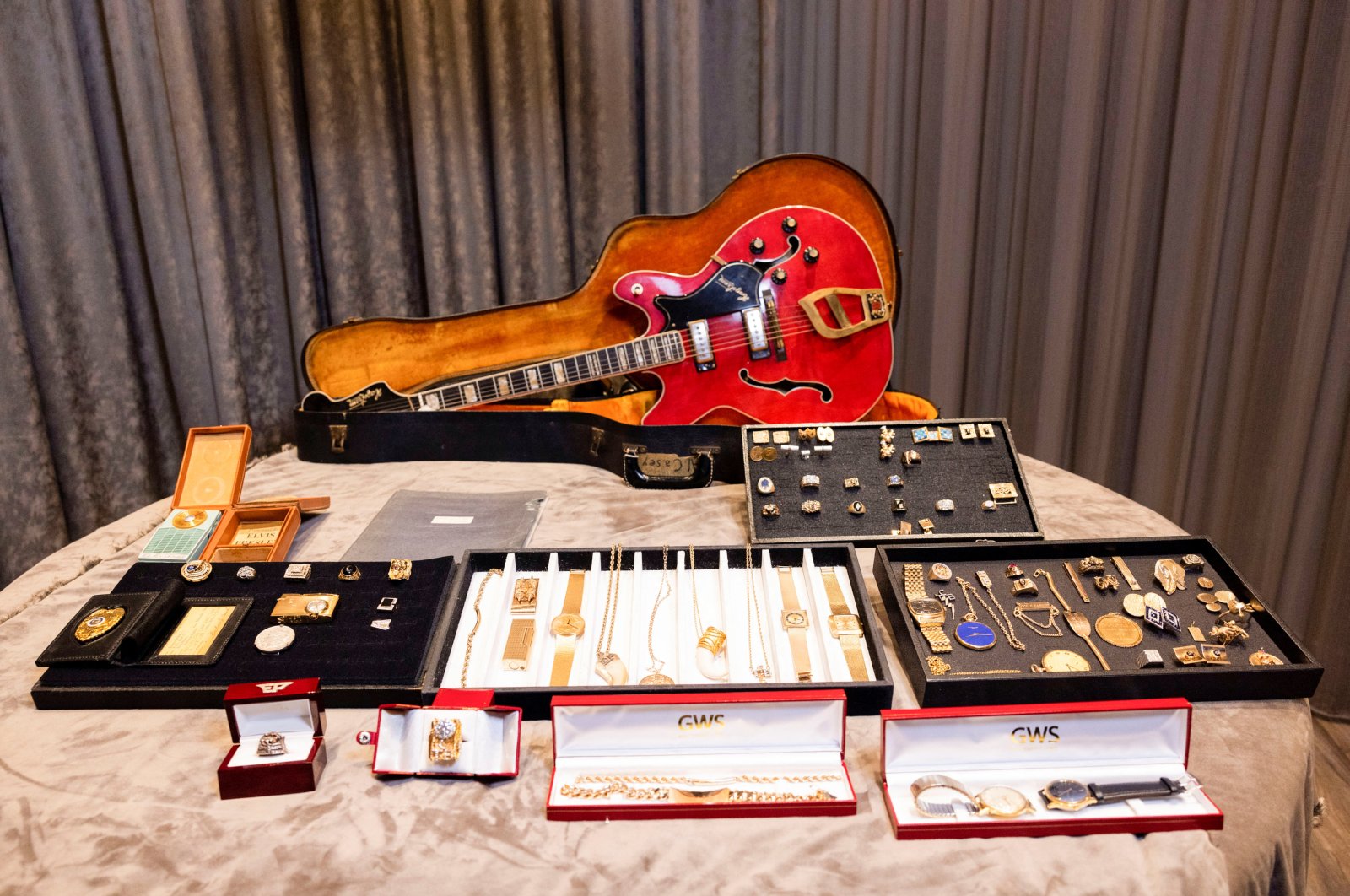A view of a guitar and a collection of personal jewelry of Elvis Presley and Colonel Tom Parker that was lost for decades and will be sold at auction in August, at the Sunset Marquis Hotel, in Hollywood, California, U.S., July 28, 2022. (Reuters Photo)
