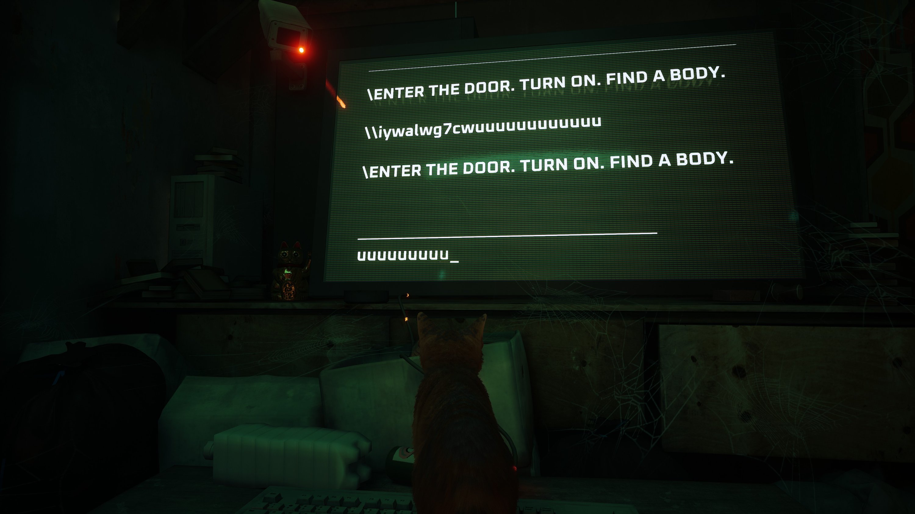 A mysterious intelligence tries to communicate with the cat while the cat writes gibberish on the keyboard, in a screenshot from the video game Stray.