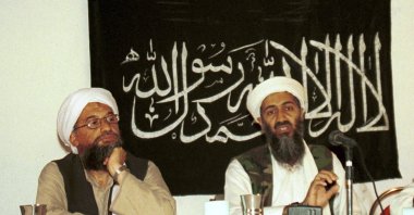 In this 1998 file photo made available March 19, 2004, Ayman al-Zawahri (L) listens during a news conference with Osama bin Laden in Khost, Afghanistan. (AP Photo)