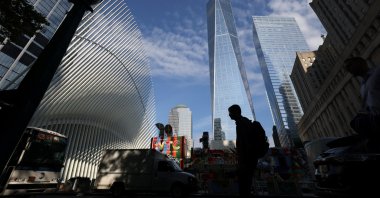 People walk by One World Trade Center after U.S. President Joe Biden confirmed the death of al-Qaida leader Ayman al-Zawahiri, Manhattan, New York City, U.S., Aug. 2, 2022. (Reuters Photo)
