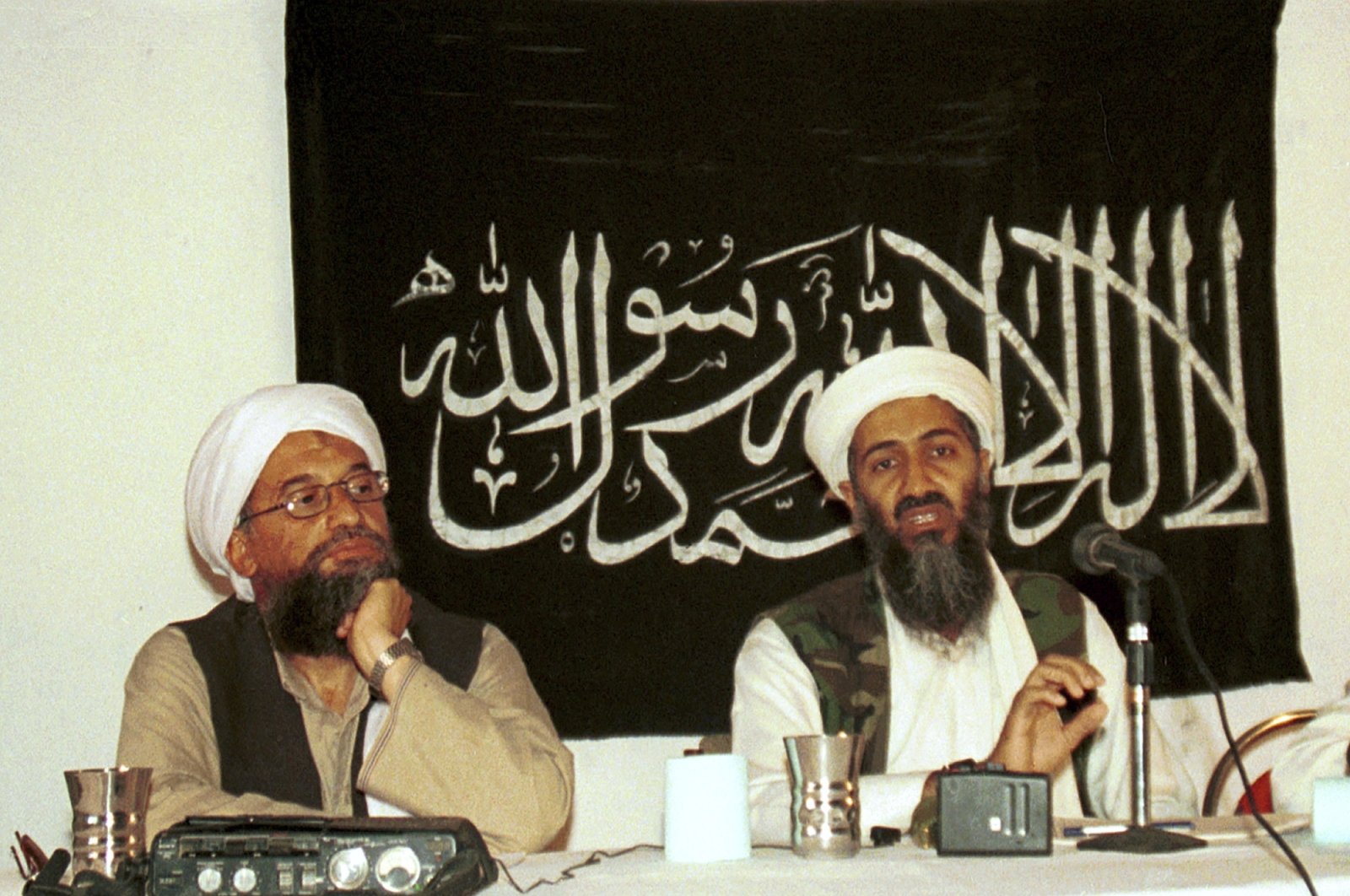 In this 1998 file photo made available March 19, 2004, Ayman al-Zawahri (L) listens during a news conference with Osama bin Laden in Khost, Afghanistan. (AP Photo)