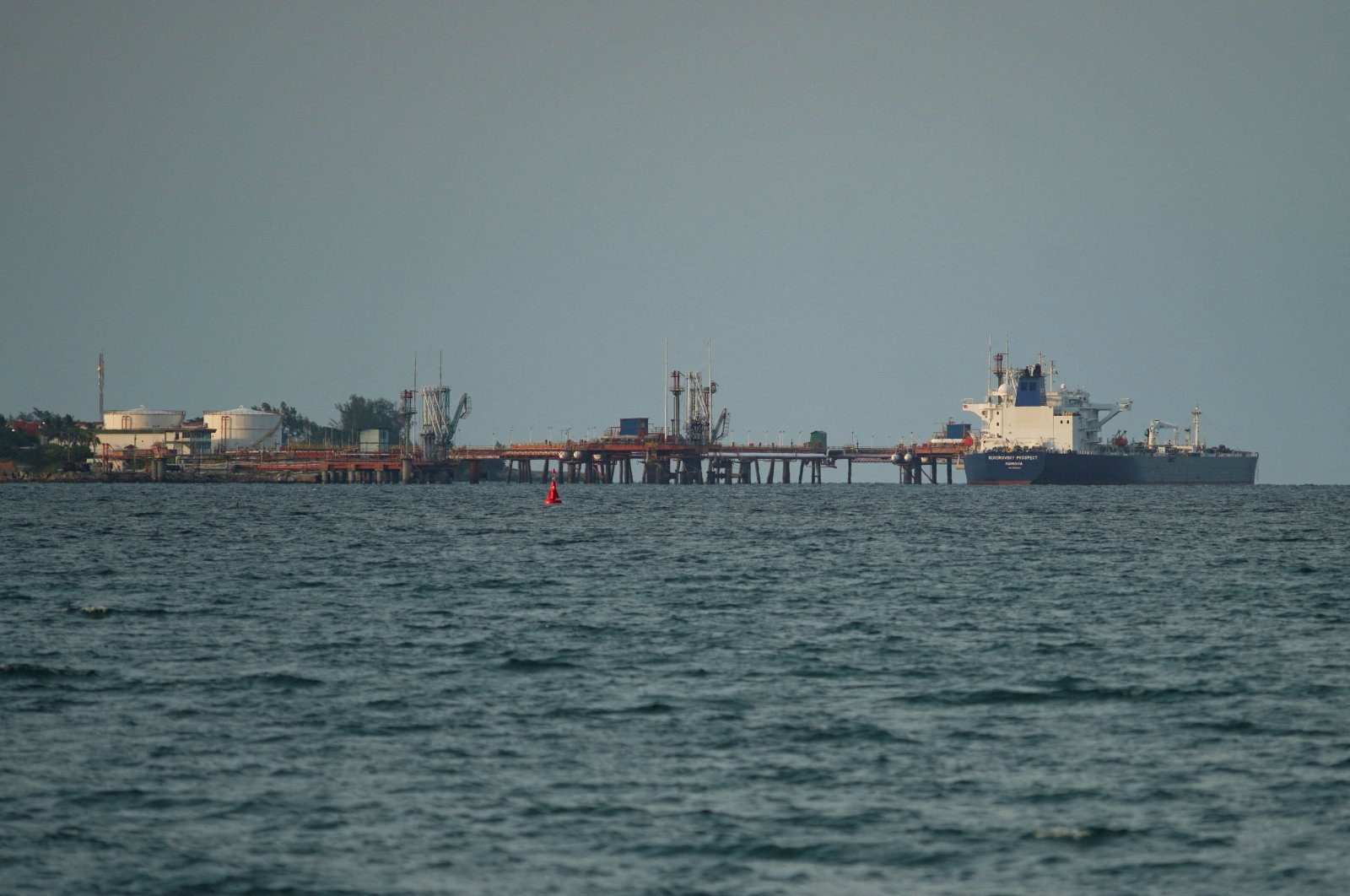The Liberia-flagged Aframax tanker Suvorovsky Prospect discharges oil from Russia at the Matanzas terminal, in Matanzas, Cuba, July 16, 2022. (Reuters Photo)