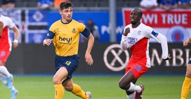 Union's Dante Vanzeir and Rangers' Glen Kamara fight for the ball during a UEFA Champions League qualifying match, Heverlee, Belgium, Aug. 2, 2022. (AFP Photo)