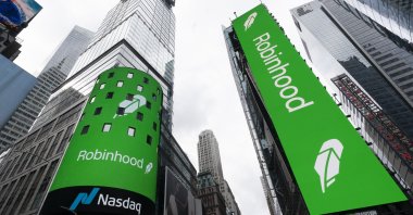 Electronic screens in Times Square announce the Robinhood IPO in New York, U.S., July 29, 2021. (AP Photo)
