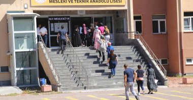 People enter a school to sit the KPSS exam, in Kayseri, central Turkey, July 31, 2022. (AA PHOTO)