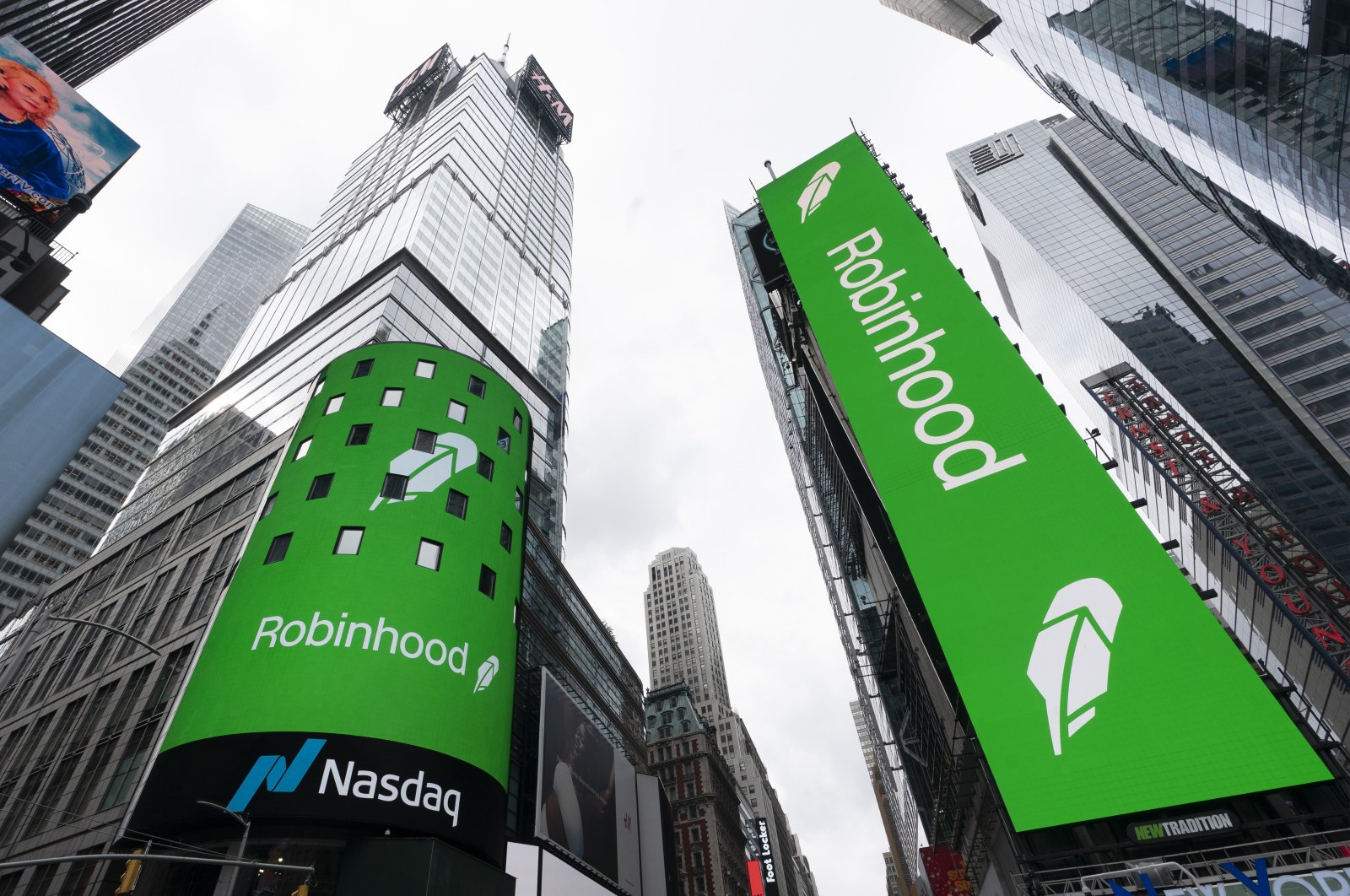 Electronic screens in Times Square announce the Robinhood IPO in New York, U.S., July 29, 2021. (AP Photo)