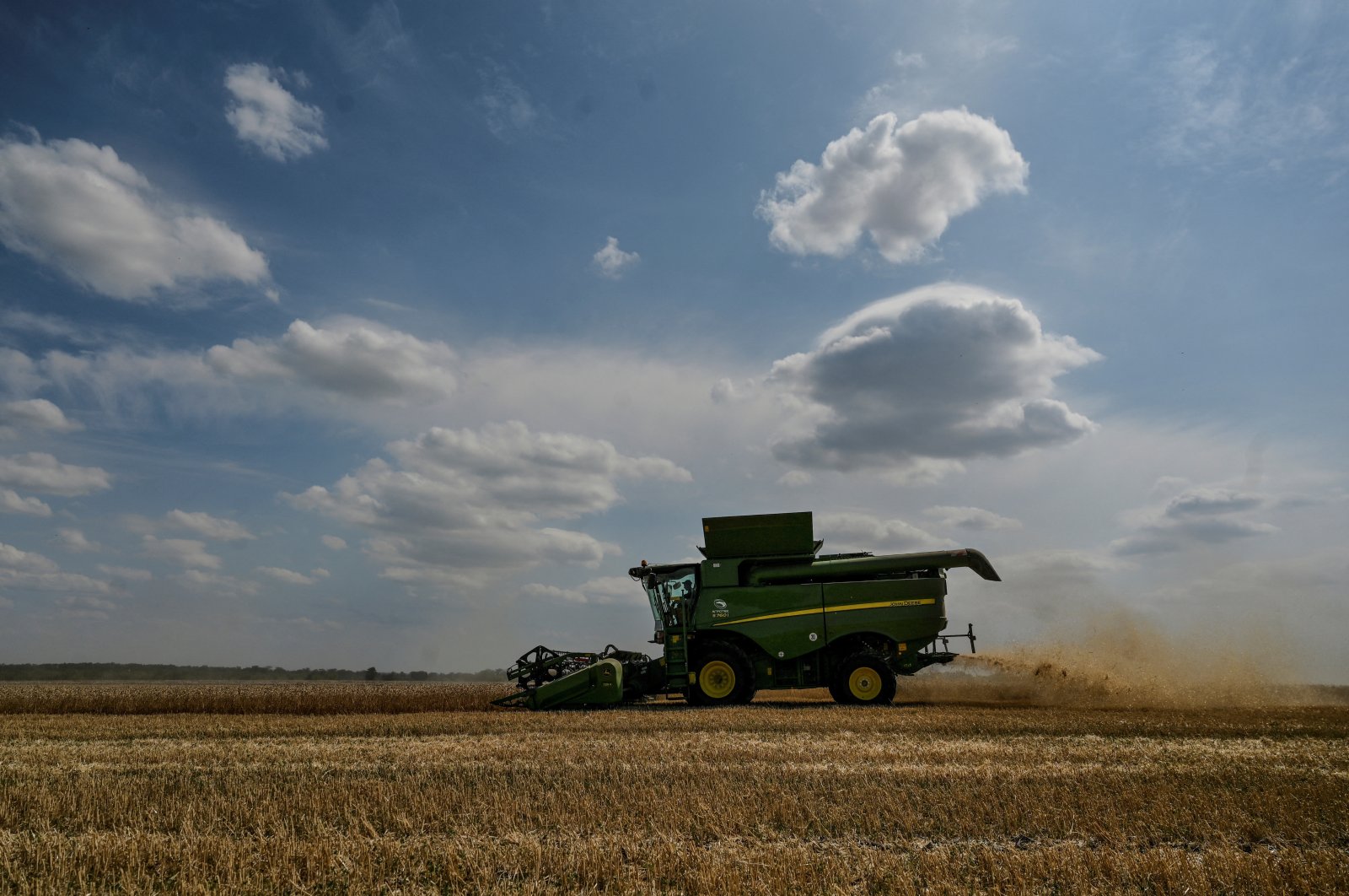 A combine harvests wheat in a field, as Russia&#039;s attack on Ukraine continues, Zaporizhzhia region, Ukraine, July 29, 2022. (Reuters Photo)