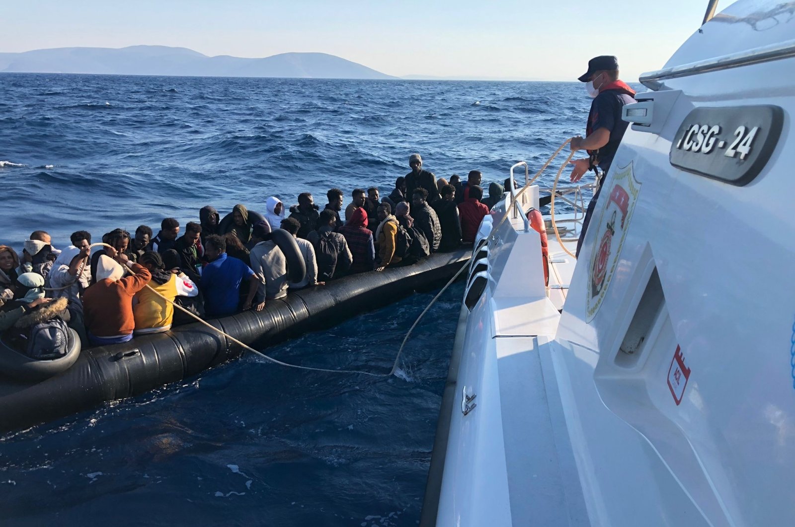 Turkish coast guard units rescue irregular migrants off Çeşme in Izmir, Aug. 3, 2022. (IHA Photo)