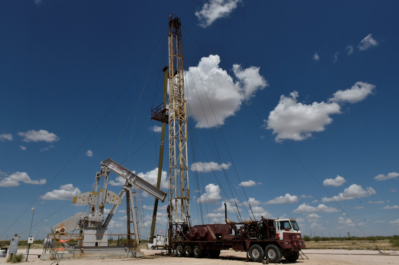 A work-over rig performs maintenance on an oil well in the Permian Basin oil production area near Wink, Texas, U.S., Aug. 22, 2018. (Reuters Photo)