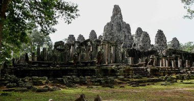 This photo shows macaque monkeys next to Bayon Temple in Angkor Park in Siem Reap province, Cambodia, July 7, 2022. (AFP Photo)