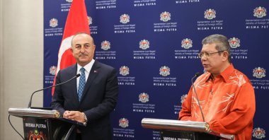 Foreign Minister Mevlüt Çavuşoğlu is seen together with his Malaysian counterpart Saifuddin Abdullah in Kuala Lumpur, Malaysia, Aug. 4, 2022 (AA Photo)