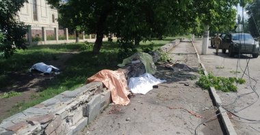 Bodies of people killed by a Russian military strike are pictured near a stop for public transport in the town of Toretsk, in the Donetsk region, Ukraine, Aug. 4, 2022. (Press service of the Donetsk Regional Military-Civil Administration via Reuters)