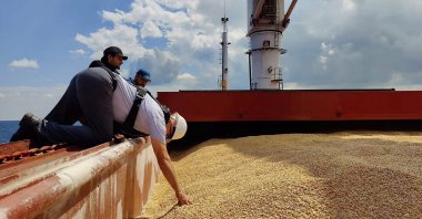 An inspection delegation member inspects the Sierra Leone-flagged cargo ship Razoni off the coast of Istanbul, Turkey, Aug. 3, 2022.
