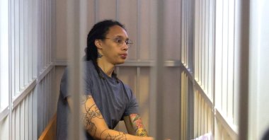 U.S. Women's National Basketball Association (WNBA) basketball player Brittney Griner, who was detained at Moscow's Sheremetyevo airport and later charged with illegal possession of cannabis, sits inside a defendant's cage after the court's verdict during a hearing in Khimki outside Moscow, Russia, Aug. 4, 2022. (AFP Photo)