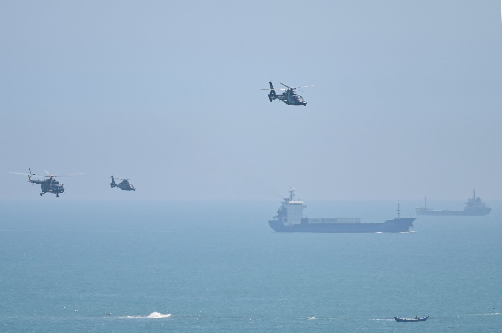 Chinese military helicopters fly past Pingtan island, one of mainland China&#039;s closest point from Taiwan, ahead of massive military drills off Taiwan after U.S. House Speaker Nancy Pelosi&#039;s visit, Fujian province, China, Aug. 4, 2022. (AFP Photo)