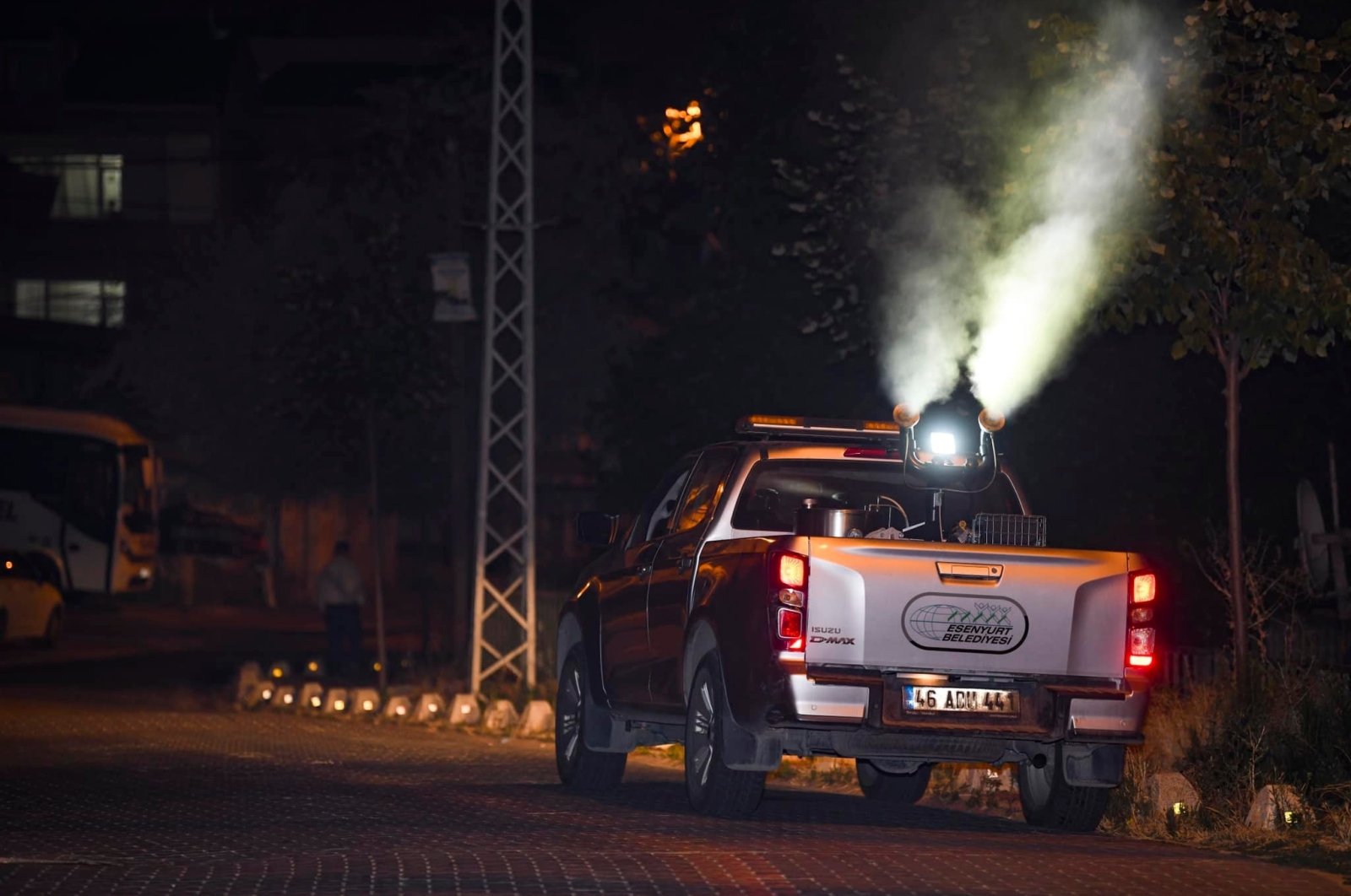 A pickup truck of the municipality sprays mosquito repellent, in Esenyurt district, in Istanbul, Turkey, July 31, 2022. (İHA PHOTO)