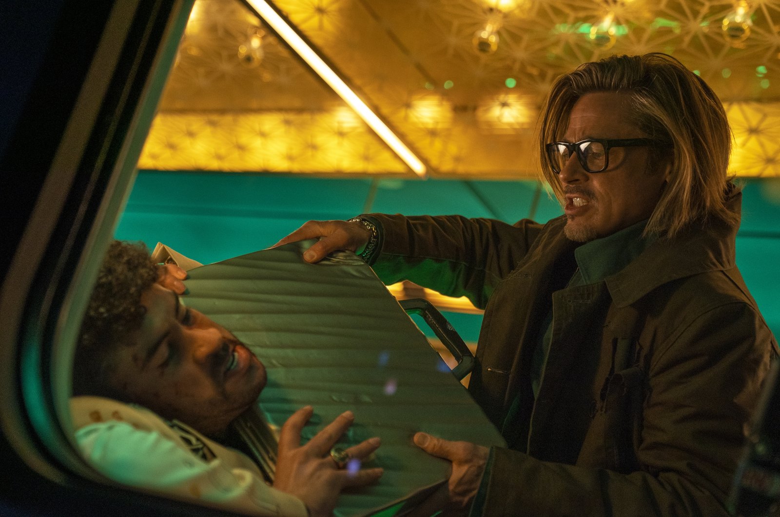 This image released by Sony Pictures shows Bad Bunny (L) and Brad Pitt in a scene from &quot;Bullet Train.&quot; (AP Photo)
