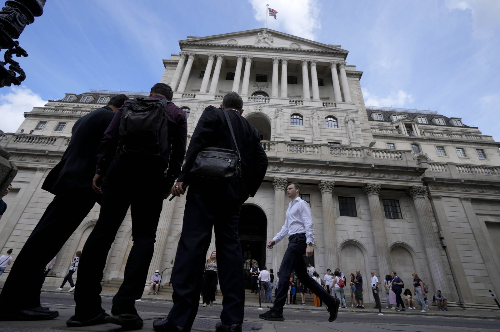 People wait at the Bank of England in London, U.K., Aug. 4, 2022. (AP Photo)