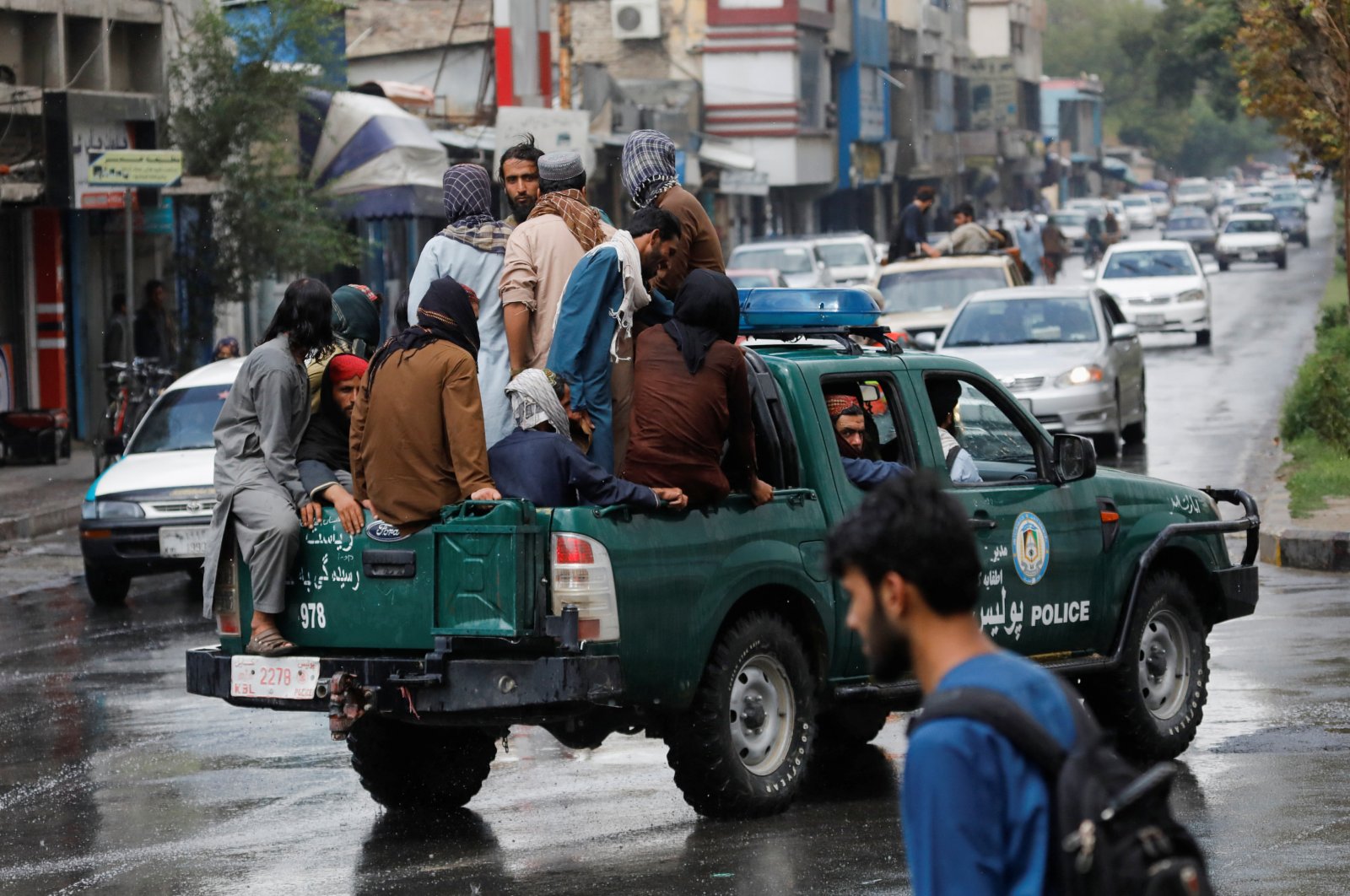 Taliban fighters drive a car on a street following the killing of Al Qaeda leader Ayman al-Zawahiri in a U.S. strike over the weekend, in Kabul, Afghanistan, Aug. 2, 2022. (Reuters Photo)