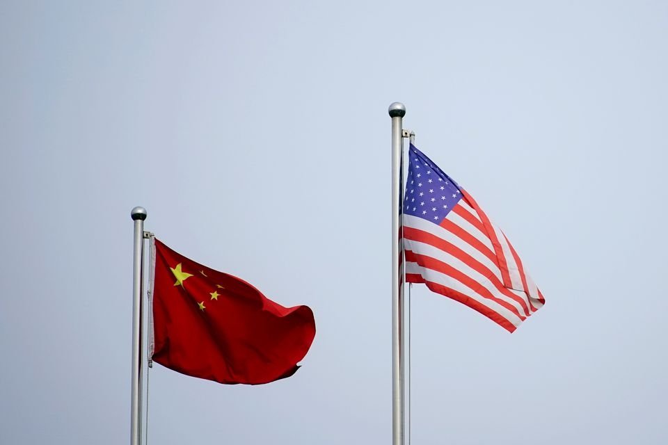 Chinese and U.S. flags flutter outside a company building in Shanghai, China, April 14, 2021. (Reuters Photo)