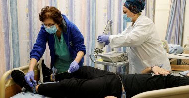 A patient suffering from long COVID-19 is examined by medical staff, at Ichilov Hospital in Tel Aviv, Israel, Feb. 21, 2022. (Reuters Photo)