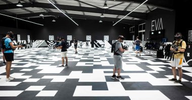 Players play the game &quot;After H Battle Arena&quot; in an esports hall in Toulouse, France, Aug. 3, 2022. (AFP PHOTO) 