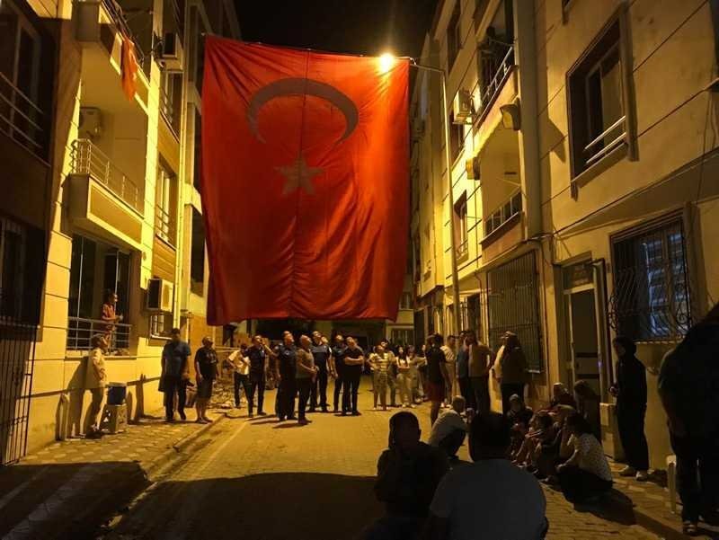 Turkish flags were hanged to between the buildings located in the neighborhood of Infantry Specialist Sgt. Reşat Erginer, who was killed during a counterterrorism operation in northern Iraq, Aug. 6, 2022. (DHA Photo)