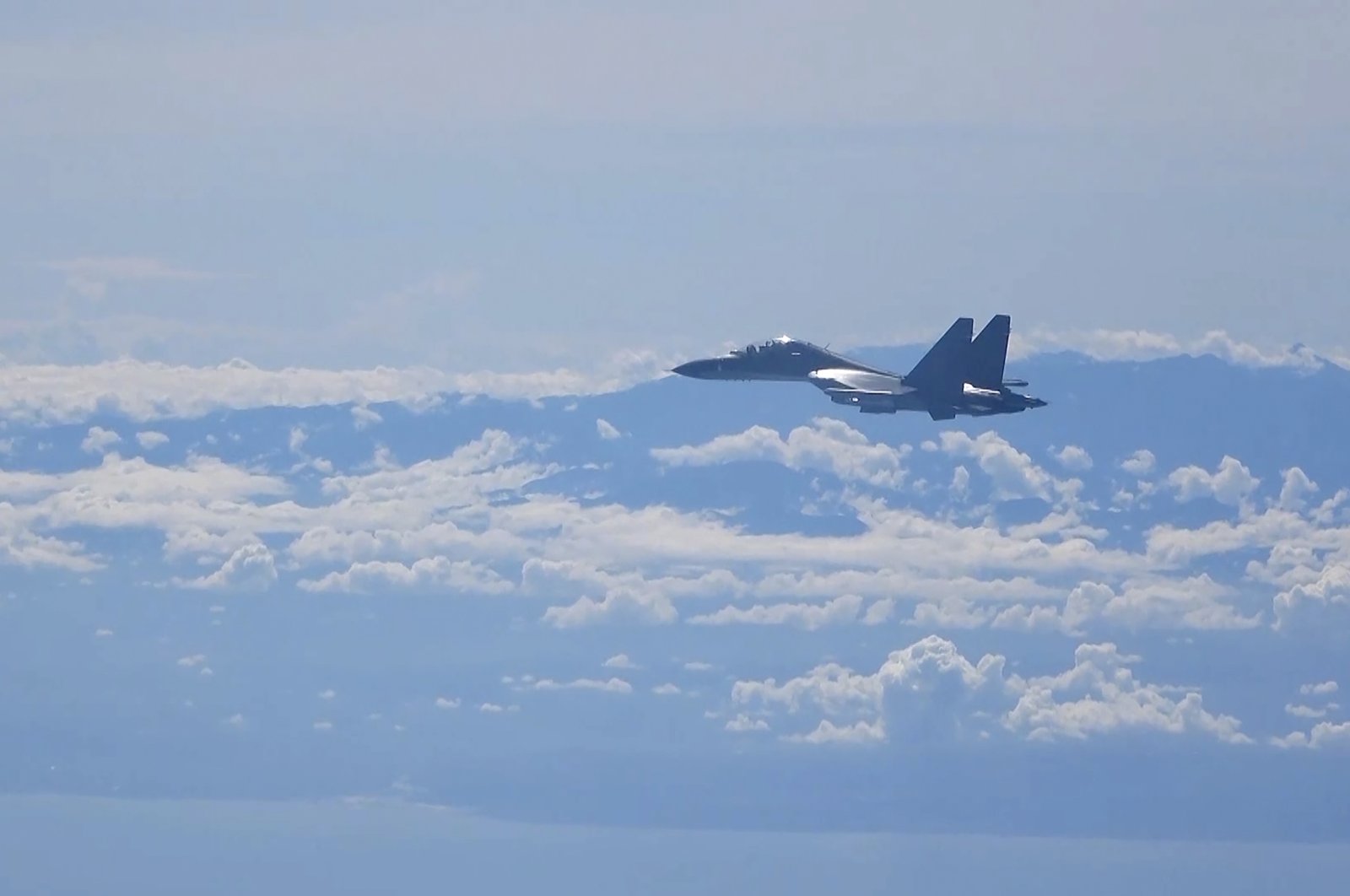 In this image made from video and released by China&#039;s Xinhua News Agency, a Chinese military plane flies during a training exercise of the air force corps of the Eastern Theater Command of the Chinese People&#039;s Liberation Army (PLA), Aug. 5, 2022. (AP Photo)