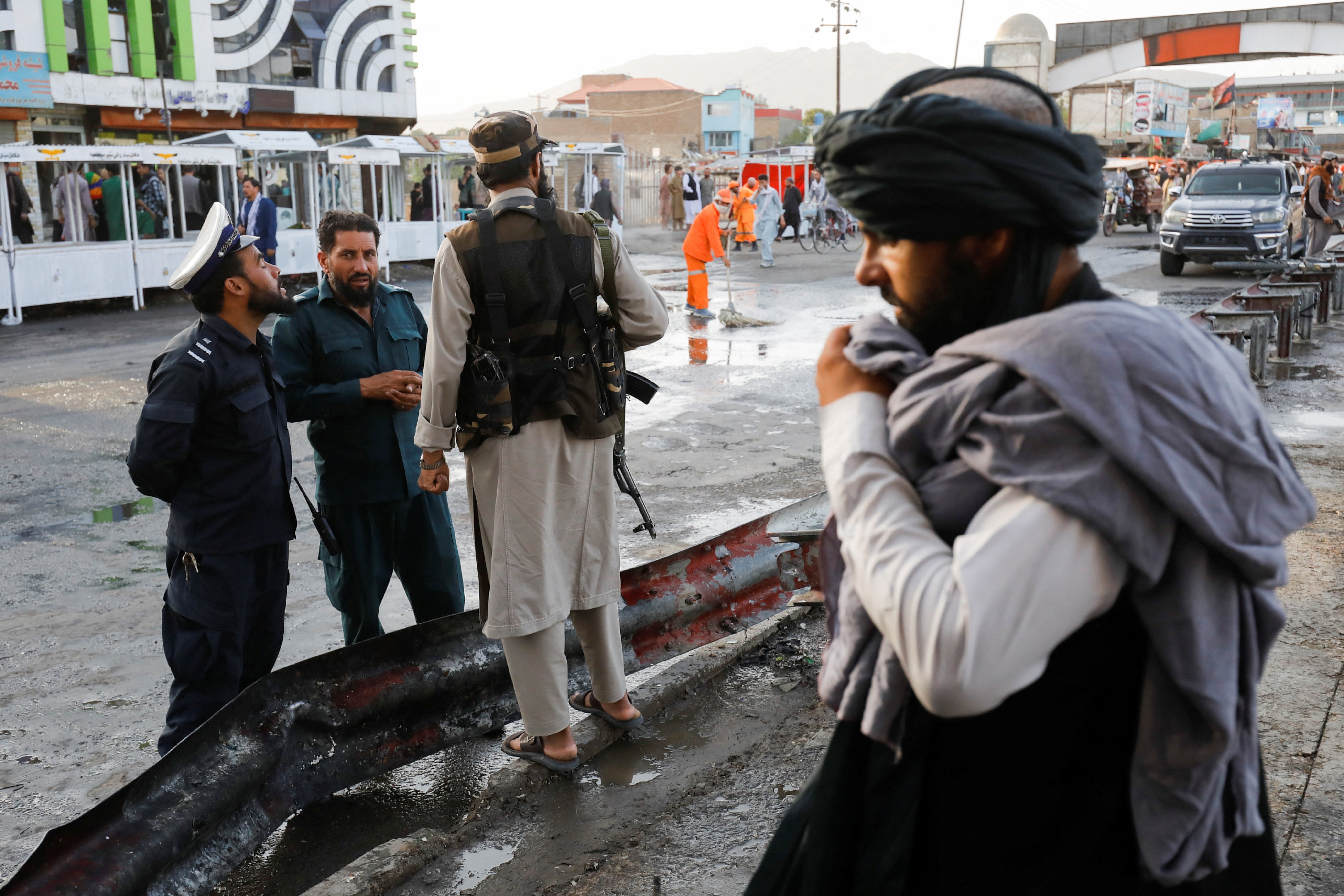 Taliban fighters stand guard at the site of a blast in Kabul, Afghanistan, Aug. 6, 2022. (REUTERS PHOTO)