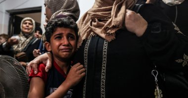Relatives of a young Palestinian killed by Israeli airstrikes during the night in the Jabalia refugee camp in the northern Gaza Strip mourn at his funeral in the same camp, Palestine, Aug. 7, 2022. (AFP Photo)
